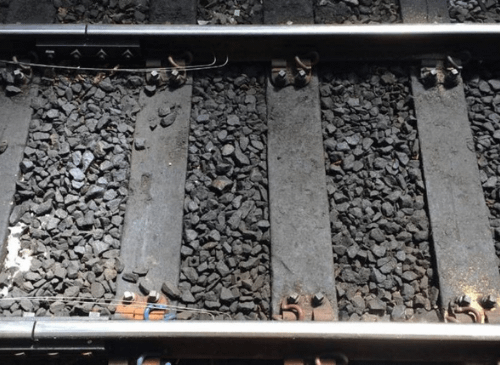 The images shows a close up of some train tracks.