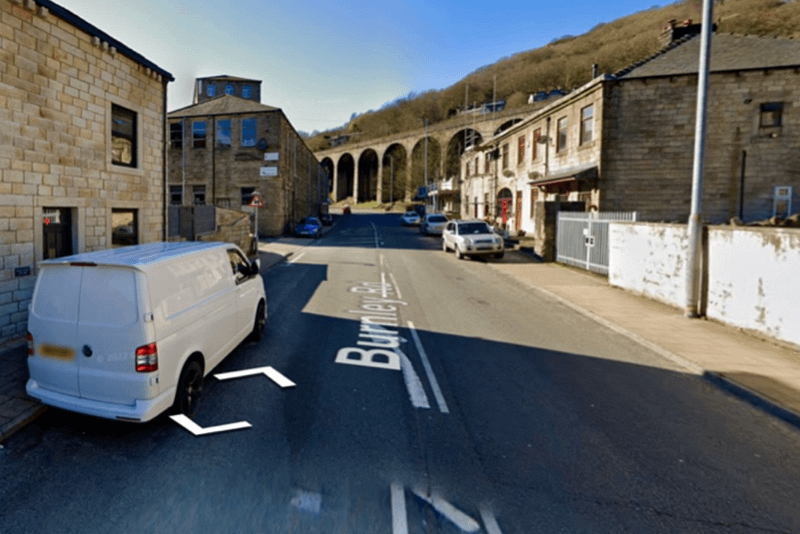 Street view of Burnley Road OL14 with white van parked on left hand side