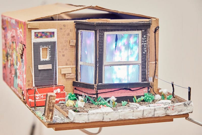 artwork of a 3D cardboard and painted house