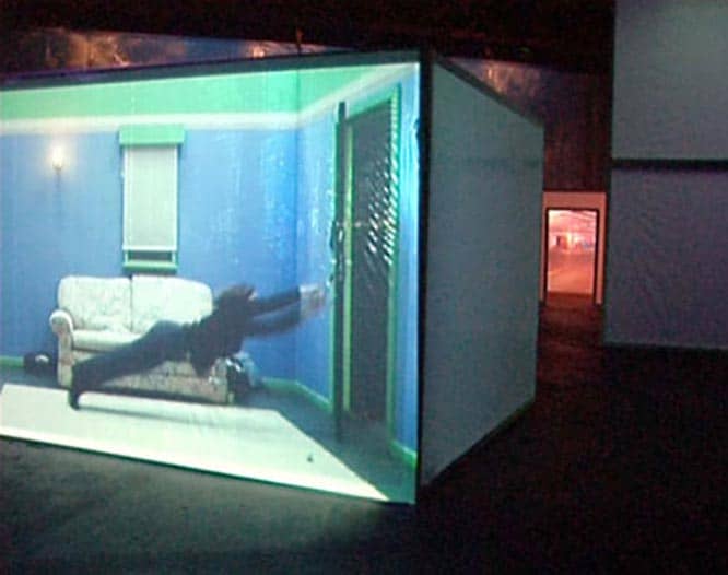 Projection showing woman diving towards an open door
